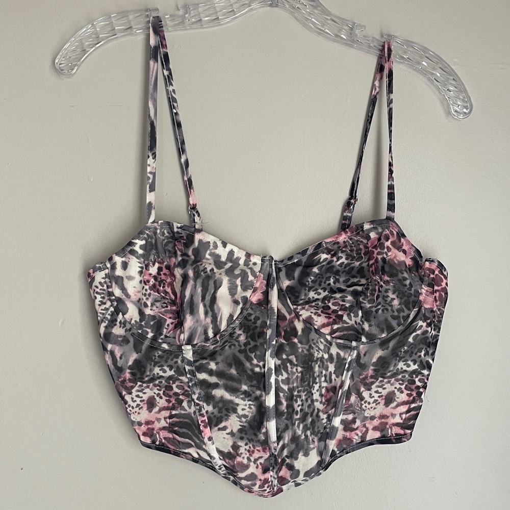Fierce and flirty mesh bustier top in a pink + grey animal print.